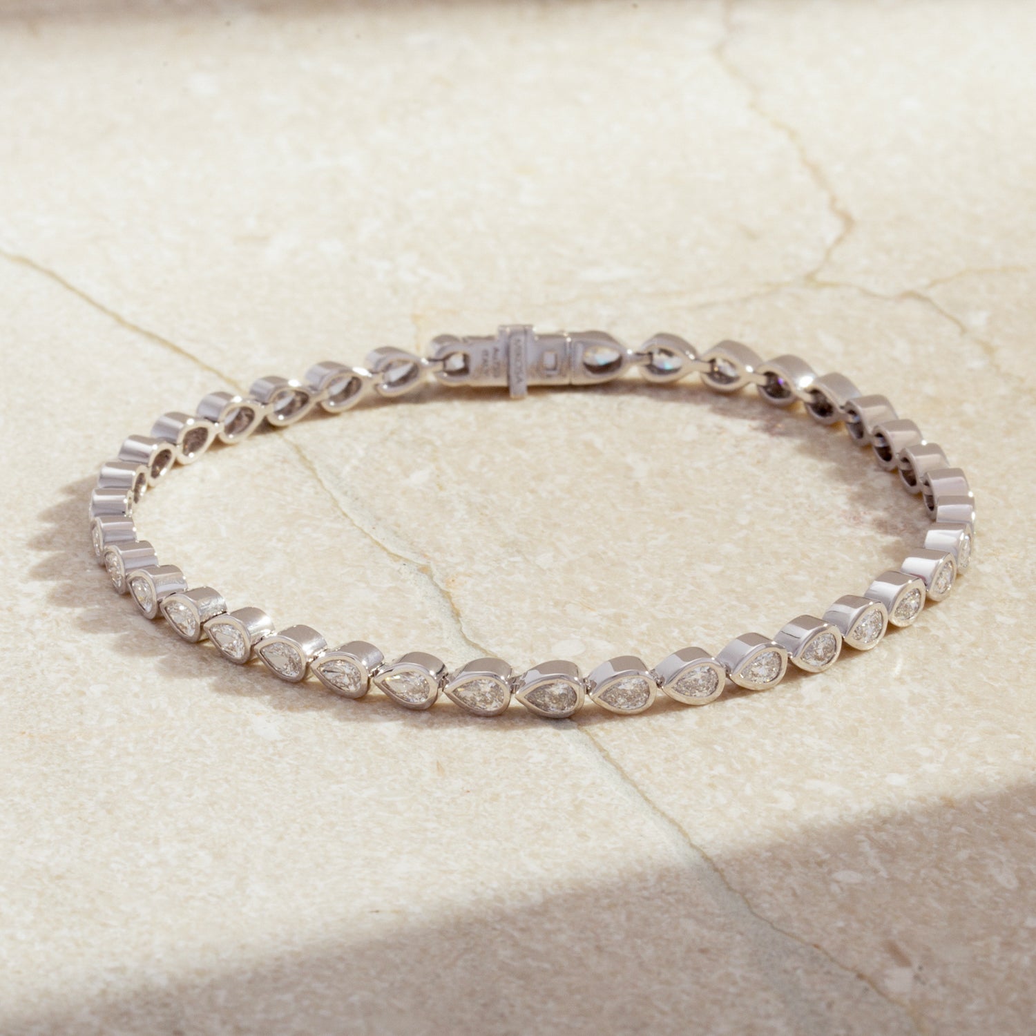 18K Pear Cut Diamond Bezel Tennis Bracelet